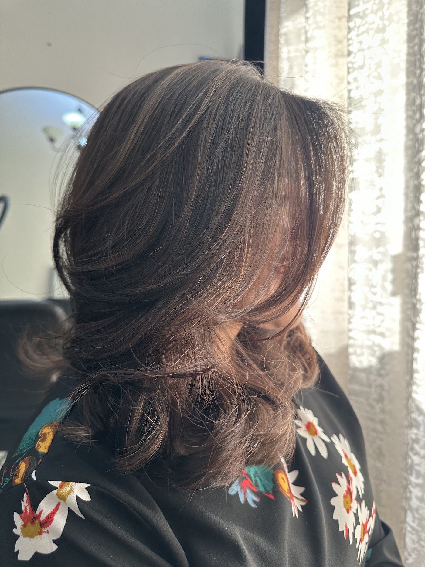 Soft layered brunette hair with caramel tones styled by Samantha